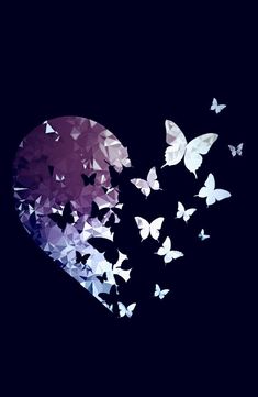 butterflies flying in the shape of a heart on a dark background with space for text