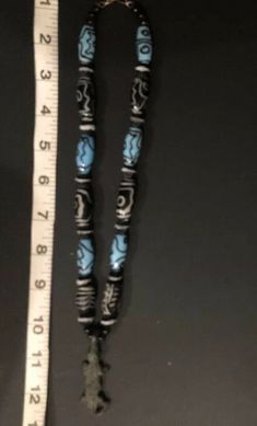 Very Very Old! Antique African AKAN/ASHANTI Necklace Crocodile Pendant with mixed beads. One is an old feather, black and white bead. One looks hand painted black & white. There are several blue/black beads that look Venetian. There are also many smaller black, ribbed round beads with white edge. Crocodile is made of sold brass. He's approx 2 inches. Necklace Choker is approx 12 inches. Ashanti also known as Asante, are part of the Akan ethnic group and are native to the Ashanti Region of mo Traditional Blue Jewelry With Wooden Beads, Artisan Black Beaded Necklaces For Jewelry Making, Artisan Black Beads Necklace For Festival, Traditional Blue Wooden Beads, Traditional Turquoise Necklace With Wooden Beads, Traditional Turquoise Beaded Necklace With Wooden Beads, Traditional Turquoise Beaded Necklaces With Wooden Beads, Traditional Adjustable Black Bead Necklaces, Traditional Long Necklace With Black Beads