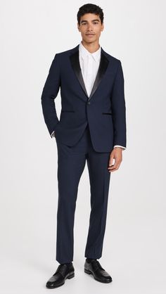 Find THEORY Chambers Tuxedo Jacket on Editorialist. Fabric: Mid-weight, stretch suiting. Lightly padded shoulders. Satin trim. Collared neckline with notched lapels. Long sleeves with button cuffs. Single-button placket. Welt hip and breast pockets. Welt interior pockets. Shell: 98% wool/2% elastane. Lined. Lining: 100% cupro. Dry clean. Imported, China. Measurements: Measurements from size 38R Length: 27.5in / 70cm Sleeve: 31.5in / 80cm Chest: 39.25in / 100cm Prom Queen, Slim Fit Tuxedo, Tuxedo Pants, Tuxedo Blazer, Prom Queens, Tuxedo For Men, Tuxedo Jacket, Stretch Velvet, Black Blazers