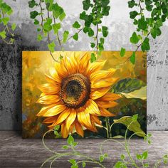 a painting of a yellow sunflower on a wooden table next to green leaves and branches