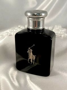 Vintage Ralph Lauren ‘Polo Black’ (for Men) Eau De Toilette Spray. Condition is Pre-owned. 2.5 fl.oz./75ml Bottle. 2/3 full. Liquid level is even with the top of horse’s head on Polo graphic. (See backlit photo that shows content level.) Fragrances For Men, Man Perfume, Mens Perfume, Cologne For Men, Polo Perfume Woman, Polo Ralf Lauren, Men’s Best Perfumes, Polo Cologne, Ralph Lauren Perfume