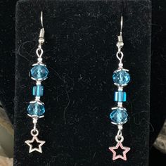 Pretty little blue  swarovski crystals make up this pair of earrings. Add a tiny star and wala! Nice gift for Mother's Day or any birthday/anniversary/Christmas. Got a Q? drop me a note! Enjoy! peace Blue Star Charm Earrings For Gift, Silver Star Charm Crystal Earrings For Gift, Blue Star Charm Earrings As Gift, Star-shaped Crystal Earrings For Gifts, Hypoallergenic Blue Star Earrings, Blue Dangle Earrings For Birthday, Blue Earrings For Pierced Ears, Birthday, Blue Dangle Jewelry For Birthday, Blue Hypoallergenic Crystal Earrings As Gift