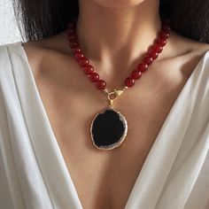 R E D ∙ C A R N E L I A N ∙ N E C K L A CE 💎Features: * Material: Natural Red Carnelian Beads,Natural Black Agate, Brass Clasp-Gold Plated, Tarnish Free * Gemstone Grade: AAAAAAA, High Quality genuine gemstone. * Beads Size: 12mm large size * Pendant Size:  * Color: Rich, lustrous red beads, Black Agate Pendant, 14K Gold color for hardware * Detachable Pendant for versatile styling: Wear it for bold or remove for minimalist elegance. Switch effortlessly between 2 styles. * Length: 16 to 26 inch Luxury Elegant Carnelian Beaded Necklaces, Red Beaded Pendant Necklace With Natural Stones, Red Agate Beaded Necklace With Gemstone Beads, Red Beaded Agate Necklaces, Black Agate Beaded Necklace With Gemstones, Black Carnelian Jewelry For Gifts, Red Agate Round Bead Crystal Necklaces, Red Beaded Agate Gems And Cabochons, Red Agate Beaded Gems And Cabochons