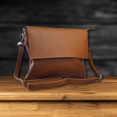 Elevate your style with our premium leather crossbody bag. This versatile, handcrafted bag is perfect for any occasion, from festivals to everyday use. Product Details: ✅ Made from high-quality, leather ✅ Dimensions: L 26cm, W 3cm, H 21.5cm, Strap Length: 90cm ✅ Adjustable strap for a comfortable fit ✅ Back zip pocket for added security ✅ Suitable for women and men as a stylish and practical accessory Perfect for: ✅ Crossbody phone bag ✅ Camera bag ✅ Small tote bag ✅ Shoulder bag ✅ Purse ✅ Festi Messenger Bag Leather, Leather Sling Bag, Travel Handbags, Handcrafted Bags, Festival Bag, Small Tote Bag, Handbags Women, Handbag Leather, Leather Crossbody Purse