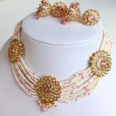 Absolutely stunning handmade jewelry set with pink, gold, and white detailing to add to any gorgeous outfit! Fully adjustable necklace Necklace decorative length: 10 inch Earring length:  1.6 inch Earring width:  0.6 inch **Looking to bundle/add-on? Message me for an additional 5% off your cart! Always gift wrapped & dispatched with free, tracked shipping 🧡 All photos are taken in natural lighting without editing, but our jewelry is really shiny so it may reflect a little differently in differe White Bridal Necklace With Gota Work As Gift, White Bridal Necklace With Gota Work For Gift, Traditional Handmade Pink Jewelry Sets, White Necklaces With Gota Work For Celebration, White Necklace With Gota Work For Festive Occasions, Pink Meenakari Necklaces For Festive Occasions, White Jhumkas With Stone Work For Gift, Traditional Pink Jewelry Sets For Gifts, Festive White Necklace With Gota Work