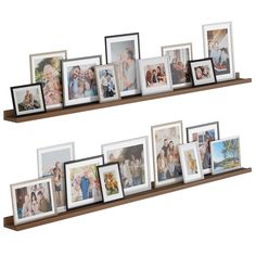 two wooden shelves with multiple pictures on them and one shelf holding several framed photos in it