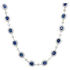 This spectacular blue sapphire and diamond Riviera necklace epitomizes luxury, class and style! The 24 beautifully matched oval sapphires weigh over 12 carats total and possess quintessential cornflower blue color that connoisseurs think of when they envision the finest sapphires! Each gem is set in 18k white gold with its own sparkling white diamond halo, then linked together in an exquisite design accented by light lemon yellow diamonds. This stunning necklace was designed to be flexible so it Riviera Necklace, Gold Drapes, Yellow Diamonds, Ring Pendant Necklace, Stunning Necklace, Cornflower Blue, Lemon Yellow, Yellow Diamond, Diamond Halo