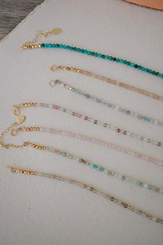 Our Leilani Beaded Necklace is your new must-have layering necklace! What do we love about it? With a range of gemstone options and the ability to choose between charm options including letters, a textured coin, or a pearl, this dainty necklace is perfect for layering while adding a personal touch. Crafted with high-quality gemstones and a secure clasp, this necklace is sure to be a staple in your wardrobe for years to come! Everyday Single Strand Crystal Necklace With Round Beads, Everyday Beaded 14k Gold-filled Necklaces, Handmade Delicate Beaded Necklaces For Everyday, Everyday Beaded 14k Gold-filled Necklace, Everyday Beaded 14k Gold Filled Necklace, Adjustable 14k Gold Filled Necklaces With Round Beads, Everyday Round Gemstone Beads Necklace, Delicate Handmade Beaded Necklaces, Dainty Single Strand Necklaces With Round Beads