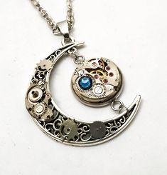 Crescent moon jewelry necklace Silver Antique Celestial pendant Steampunk Watch parts Steam punk For Steampunk Silver Metal Necklaces, Silver Steampunk Metal Necklace, Retro Sterling Silver Jewelry Gift, Retro Sterling Silver Jewelry For Gift, Handmade Steampunk Metal Necklace, Collectible Metal Jewelry With Round Pendant, Vintage Alloy Necklaces, Collectible Round Pendant Metal Jewelry, Collectible Metal Round Pendant Jewelry