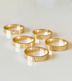 Our initial band is designed with a 4 mm wide band and hand-stamped capitalized initial. Available in a hammered or smooth finish. Choose hammered for texture + high shine or smooth for a soft, satin look. - 14k gold filled or Sterling Silver made to withstand daily wear time after time - *Enter 1 initial in the text box above Please see our 'custom typewriter ring' to customize this band with more letters or numbers. Shop here: https://runeandlight.com/collections/rings/products/custom-typewrit Time After Time, Hammered Band, Gold Filled Ring, Initial Ring, Text Box, The Text, Wide Bands, Typewriter, Runes