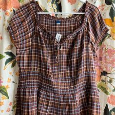 Super Cute And Comfy! Brown Plaid Peplum Shirt From Old Navy. Size Xxl. A Little Big For Me So I Never Got To Wear It. Casual Smocked Top With Ruffle Hem For Day Out, Short Sleeve Smock Blouse For Beach, Short Sleeve Peasant Top With Smocked Bodice For Daywear, Casual Smocked Top With Ruffles, Casual Smock Peasant Top With Short Sleeves, Casual Fitted Brown Peasant Top, Casual Tops With Gathered Waist And Short Sleeves, Fitted Brown Casual Peasant Top, Fitted Brown Peasant Top Casual Style