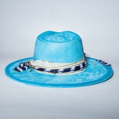 Handmade cowboy hat made with high quality fabrics and trims. ETA can take up to 14 days to delivered due to the fact that each pieces are handmade Blue Fedora Panama Hat For Kentucky Derby, Blue Panama Hat For Kentucky Derby, Blue Flat Brim Panama Hat For Kentucky Derby, Blue Brimmed Felt Hat For Summer, Blue Flat Brim Felt Hat For The Beach, Blue Flat Brim Felt Hat For Beach, Blue Wide Brim Country Style Felt Hat, Country Style Blue Wide Brim Felt Hat, Handmade Blue Flat Brim Sun Hat