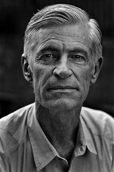 black and white photograph of an older man with short hair wearing a shirt and tie