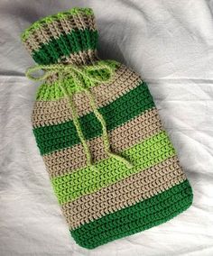 a crocheted green and beige striped bag