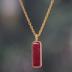 Whether elevating an elegant evening ensemble or adding regal polish to casual day wear, this modern pendant necklace is sure to be your new favorite accent. Indian artisan Neetu Barathi's impeccable design lets a striking rectangular ruby gemstone take center stage complemented by an adjustable 18k gold-plated cable chain that drapes flawlessly. Bring bold sophistication to your look with this stunning accessory filled with color and vibrancy. Elegant Rectangular Pendant Necklace With Polished Finish, Elegant Necklace With Rectangular Pendant And Polished Finish, Elegant Necklace With Polished Rectangular Pendant, Elegant Polished Rectangular Pendant Necklace, Gold Plated Rectangular Pendant Necklace For Formal Occasions, Gold Plated Necklace With Rectangular Pendant For Formal Occasions, Formal Gold-plated Necklace With Rectangular Pendant, Formal Necklace With Rectangular Pendant And Polished Finish, Formal Necklace With Rectangular Polished Pendant