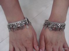 "Vintage Antique ethnic collectible very nice tribal old silver charm Bracelet or bangle pair from Rajasthan India. Worn by Banjara tribal people of Rajasthan. Beautiful workmanship all over the piece, adorn with silver charms. One quarter-hinged part can be open by pin. Original old pair in good condition with great antique look. great pair for jeweley collection. Inner diameter across - 5.3 cm(2\") Inner circumference -16.6 cm (6.5\") width include charms - 2.6 cm(1\") weight for pair - 92.5 g Silver Bracelets With Tilla, Bohemian Sterling Silver Bracelets For Festive Occasions, Silver Tilla Bracelets, Ceremonial Oxidized Bracelets, Bohemian Silver Bracelets For Festive Occasion, Bohemian Silver Bracelet For Festive Occasion, Bohemian Nickel-free Bangle, Traditional Silver Metal Bangle, Antique Silver Oxidized Bracelets For Rituals