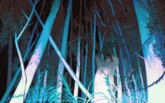 a man standing in the middle of tall bamboo trees at night with blue lights on them