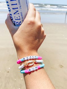 Headed on a beach vacation?! This makes the perfect beach accessory. "Beach Bum" pink and turquoise bracelets with white puka shell stretchy bracelet. Beachy White Stretch Bracelet For Vacation, White Beachy Stretch Bracelet For Summer, White Strand Stretch Bracelet For The Beach, White Beach Bracelets For Beach Season, White Bracelets For Beach Season, Adjustable White Stretch Bracelet For Beach Season, Adjustable White Stretch Bracelet For Beach, Beachy Beaded Bracelets For Beach Season Vacation, Beachy White Friendship Bracelets For Vacation