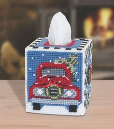 a tissue box with a christmas truck on it