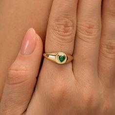 Lilliana Home is where the emerald heart is. For many, the emerald is considered to be the symbol of rebirth. The unique heart cut on this dainty solid gold signet ring is one of a kind. This ring can also be worn as a pinky ring. Available in Yellow Gold, Rose Gold, and White Gold. - Handmade- Solid Gold- Natural Emerald- Total Emerald Carat Weight: .25 ctw- Ring Dimension: 8 mm to 2.5 mm All pieces come beautifully boxed in suede pouches you can always use (which really comes in handy when tra Heart Signet Ring, Gold Signet Ring, Home Is Where, Pinky Ring, Color Ring, Gold Jewelry Fashion, Natural Emerald, Gold Set, Emerald Ring