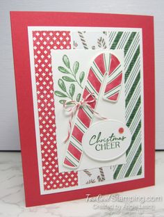 a close up of a christmas card with candy canes on the front and bottom