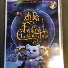 the dvd cover for elf's toy club christmas tale, with an image of two cats