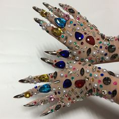 Colorful rhinestone embellished short mesh gloves with accented gold or silver nail. Choose from black or nude with multicolor accents or nude with silver accents. Made of spandex and polyester, perfect for adding a luxurious glam look to outfits. Great for parties, prom, nightlife and other special occasions. //  window.adminAccountId=232839626; //  Content created by: Jamie Nelson Look Disco, Jamie Nelson, Party Gloves, Mesh Gloves, Chunky Gold Chain, Japanese Nail Art, Embellished Shorts, Crystal Belt, Black Headband