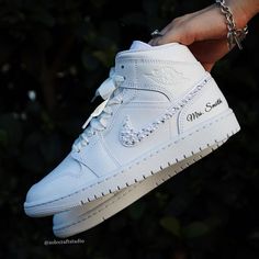 Make Your Day Extra Special With These Beautiful And Unique Custom Bridal Sneakers. Please Visit: Solecraftstudio.Com For A Better Customization Experience, And Better Prices. Brand New 100% Authentic Jordan 1 Mid With Box! Rhinestones/Pearls Swoosh Bridal Custom Made-To-Order Sneaker. Satin Or Tulle Laces! Style: 4 Swooshes + Laces - This Option Includes Rhinestones/Pearls On All 4 Swooshes + Laces Of Your Choice + Lettering Of Your Choice. Get Them Personalized! To Order: Please Send Us A Mess Wedding With Jordans Shoes, Wedding Shoes Jordans, Bride Nikes Bridal Shoes, Wedding Shoes Comfortable Sneakers, Wedding Dresses With Tennis Shoes, Bride And Groom Matching Sneakers, Wedding Nike Blazers, Nike Wedding Sneakers, White Sneakers For Wedding