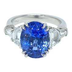 Trillion Cut Engagement Ring, Cornflower Blue Sapphire, Blue Sapphire Diamond Ring, Diamond Rings Design, Sapphire And Diamond Ring, Modern Engagement Rings, Baguette Diamonds, Engagement Rings Platinum, Blue Sapphire Diamond