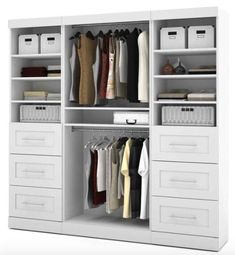 an open white closet with drawers and clothes