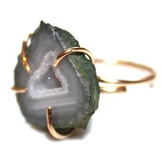 This chunky geode ring has a pretty grey and blue pattern. The naturally beautiful stone is set in an adjustable gold filled setting. This adjustable ring is best for sizes between 5 and 8. Love! xoxoxo payton For more cool jewelry looks, check out http://www.etsy.com/shop/FizzCandy All FizzCandy creations come beautifully wrapped in a colorful canvas bag which is tied with a bright ribbon. Please see our store policies here - https://www.etsy.com/shop/FizzCandy/policy?ref=shopinfo_policies_left Adjustable Agate Jewelry With Raw Stone, Adjustable Agate Gemstone Rings, Adjustable Agate Open Ring Jewelry, Adjustable Agate Open Ring, Adjustable Agate Crystal Ring With Gemstone, Adjustable Raw Stone Crystal Ring For Healing, Unique Adjustable Raw Stone Jewelry, Agate Jewelry With Natural Stones In Open Ring Shape, Geode Ring