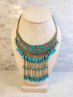 This beautiful one of a kind statement necklace will add a bohemian flare to any outfit! Definitely an eye catcher. The Bib is  4.5 inches wide with 4 inch drop. The necklace has a total length of 14 inches with a little over a 6 inch drop. Festive Bohemian Turquoise Jewelry, Bohemian Turquoise Necklace For Festive Occasions, Blue Bohemian Necklace For Festive Occasions, Bohemian Turquoise Beaded Necklaces For Festivals, Turquoise Bohemian Beaded Necklaces For Festivals, Blue Bohemian Necklaces For Festive Occasions, Bohemian Multicolor Decorative Jewelry, Festive Turquoise Bohemian Necklace, Bohemian Turquoise Beaded Necklaces For Festive Occasions