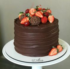 a chocolate cake with strawberries on top