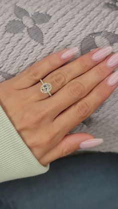 a woman's hand with a ring on it