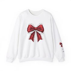 Get into the festive spirit with this Christmas coquette bow sweatshirt, perfect for the holiday season. This girly girl y2k coquette sweatshirt is a great Christmas gift for someone who loves cute and playful styles. It offers a cozy and comfy wearing experience, making it ideal for the colder months. The classic fit and clean-cut style make it a versatile addition to any wardrobe, and the ribbed knit collar ensures shape retention. Product features - Made with a medium-heavy fabric blend of 50% cotton and 50% polyester for a cozy feel - Knit in one piece using tubular knit, reducing fabric waste and adding attractiveness - Ribbed knit collar with seam for elasticity and shape retention - Double-needle stitching for top-tier durability - Ethically grown US cotton and OEKO-TEX-certified dy Coquette Sweatshirt, Cozy Christmas Outfit, Bow Sweatshirt, Christmas Attire, Christmas Coquette, Girl Y2k, Coquette Christmas, Fabric Waste, Y2k Coquette