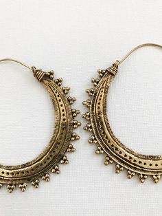 Beautiful etched brass hoops on brass ear wire. DETAILS: Brass Hoops Size: 2.5”L x2” W Can be worn daily, brass will require occasional polishing. Ships with sample polishing cloth. *Packaged for gift giving. *Sold individually. Brass Hoop Earrings With Intricate Design, Bohemian Antique Gold Brass Earrings, Bohemian Brass Earrings With Intricate Design, Ornate Brass Hoop Earrings, Intricate Brass Hoop Earrings, Vintage Hip Hop, Brass Hoops, Jewellery Designs, Brass Jewelry