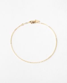 "A whisper, not a shout. Add a dainty flash of gold to your everyday look with this tiny, shiny anklet. Add a few meaningful charms or personalized disks for a look that's all yours!  Every piece is handcrafted and hand-personalized with love in La Conner, WA, using 90% recycled and 100% ethically sourced raw materials from the USA--because it's better that way. Includes free gift-ready packaging (featuring a care card and traditional letterpress goodies made by my dad)!  MATERIALS: * Gold = 14k Minimalist Adjustable Chain Anklet, Minimalist Gold Anklet With Adjustable Chain, Minimalist Gold Chain Bracelet With Rolo Chain, Gold Minimalist Chain Bracelet With Rolo Chain, Minimalist Gold Chain Anklets, Everyday Gold Chain Anklets, Minimalist Gold Rolo Chain Bracelet, Gold Minimalist Rolo Chain Bracelet, Minimalist Gold Chain Anklets As Gift