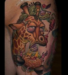 a giraffe with some food on it's back and neck tattoo design