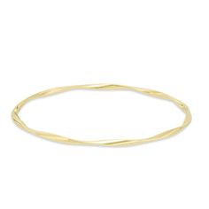 Graceful and elegant, this fashion bangle bracelet is a great day or evening wardrobe choice. Crafted in warm 14K gold, this polished design is gently twisted for a shimmering look. Wear two or more together for a bohemian chic look. Buffed to a bril Adjustable Yellow Gold Flexible Bangle, Adjustable Flexible Yellow Gold Bangle, Elegant 14k Gold Hoop Bangle, Formal 14k Gold Hoop Bracelet, Formal Yellow Gold Bangle With Modern Twist, Modern Twist Yellow Gold Bangle Bracelet, 14k Gold Hoop Bracelet With Polished Finish, Yellow Gold Flexible Bangle Bracelet, Flexible Yellow Gold Bangle Bracelets