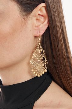 Elevate your accessory game with these captivating statement earrings. Made with top-quality gold-plated brass, these earrings exude a luxurious appeal. The intricate design, complemented by dainty bead accents, showcases exquisite craftsmanship, making it perfect for special occasions or everyday wear. Its chunky yet elegant style is sure to draw compliments and be a conversation starter. Whether paired with a chic dress or casual outfit, these earrings are a testament to timeless beauty and sophisticated design. Gold Beaded Drop Earrings, Metal Tassel Earrings With Dangling Beads, Gold Bohemian Chandelier Earrings With Dangling Beads, Gold Beads Metal Drop Earrings, Pierced Brass Beaded Drop Earrings, Brass Dangle Earrings With Gold Beads, Gold Brass Dangle Beaded Earrings, Metal Tassel Drop Earrings For Pierced Ears, Gold Beaded Dangle Chandelier Earrings