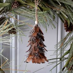 Natural mini pheasant feather tree ornament for sale. Buy hand crafted feather products to use for carnival, mardi grass, halloween, special event and home decor, cultural dance performance and more. Pheasant Feather Decor, Feather Christmas Tree, Feather Crafts Diy, Feather Wreath, Pheasant Feather, Special Events Decor, Feather Decor, Owl Ornament, Fall Thanksgiving Decor