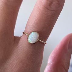 Gold Opal Ring Opal Ring Gold Ring Delicate Gold Ring - Etsy Minimalist Oval Opal Ring Gift, Minimalist Oval Opal Ring For Gift, Adjustable Oval Opal Ring Minimalist Style, Minimalist Adjustable Oval Opal Ring, White Opal Stackable Rings As Gift, White Opal Stackable Rings Gift, Dainty Oval Midi Rings For Gift, Oval Dainty Midi Rings For Gift, Oval Opal Stackable Rings As Gift