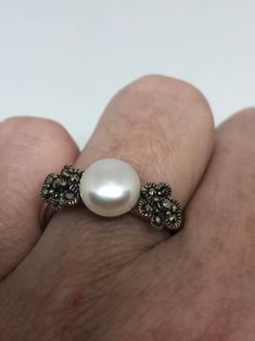 Vintage hand made Genuine Pearl set in 925 Sterling Silver with Marcasite ring Can be re sized for you. My jeweler charges about $10-$15 All rings are shipped in a nice gift box. Check out our over a THOUSAND great reviews Engraving is $4 per letter and is not always perfect depending on the piece. It can take a few days if the jeweler is busy. This is payable to Paypal Judithsltd@gmail.com Victorian Pearl Ring With Gemstone For Gift, Victorian Pearl Ring Gemstone Gift, Victorian Pearl Ring Gift, Victorian Style Pearl Ring Gift, Elegant Nickel-free Wedding Rings, Elegant Nickel Free Wedding Rings, Victorian Cabochon Pearl Ring As Gift, Victorian Cabochon Pearl Ring Gift, Victorian Style Cabochon Pearl Ring Gift