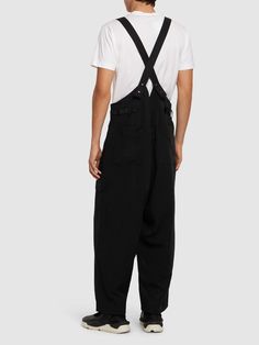 Find Y3 Tech Suspender Pants on Editorialist. Adjustable suspender straps. Front button and concealed zip closure. One front cargo pocket. Model is wearing a sizeM Black Pants Men, Suspender Pants, Leather Pant, Sport Swimwear, Pocket Model, Sports Sweatshirts, Cargo Pocket, Wide Pants, Swim Accessories