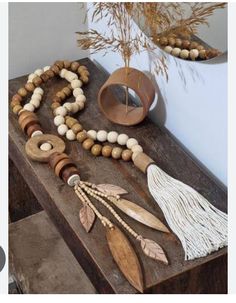 wooden beads and tassels are arranged on a table