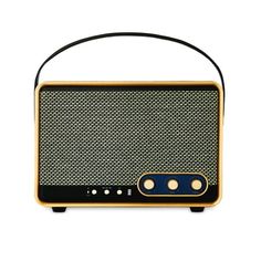 an old fashioned radio sitting on top of a white surface with black and gold trim