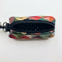 This cute little key chain coin purse is the perfect size for your loose change. Designed with a minimalist colored retro gobelin fabric. Absolute my bestselling print in my shop. It's a super cute small vegan zipper pouch to store your ear phones, earbuds, airpods, lip balm, change and coins. Or even other small accessoires. The small wallet is easy to clip thanks to the snap hook. Perfect while traveling. Size of the bag: - double padded with matching fabric inside +- 8 x 3 x 3cm +- 3,15 x 1,2 Ear Phones, Chain Purse, Loose Change, Vegan Travel, You Loose, Zippered Pouch, Small Wallet, Zipper Pouch, Key Chain