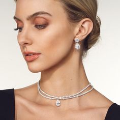 The Teardrop Crossover Diamond Choker Necklace is an exquisite piece of jewelry that exudes elegance and sophistication. Crafted with meticulous attention to detail, this necklace features a unique design that captivates the eye. At the center of the choker lies a breathtaking pear or teardrop-shaped diamond delicately nestled in a crossover pattern. The diamond, meticulously chosen for its exceptional quality and brilliance, glisten and sparkle as they catch the light, creating a dazzling displ Diamond Choker Necklace, Infinity Pendant, Diamond Choker, Fancy Color Diamonds, Gold Platinum, Lab Diamonds, Custom Rings, The Eye, Diamond Rings