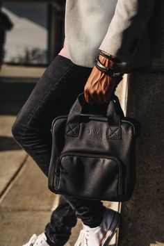 "The mero black lunch tote is made with vegan leather and is fashionable enough to carry your lunch in a way that matches your personal style. This sleek brown interior redefines the way you bring your lunch to work. Each tote is hand-sewn and allows you to carry both hot and cold items in the insulated compartments. Next, the handle for the lunch bag is durable and is more than capable of holding a full day's worth of meals. Better yet, you can pair the T|W tote with your favorite suit. Lastly, each lunch bag is unisex for both males and females. Long Term Thermal Insulation - Double layered insulation provides excellent protection to your containers and keeps food & drinks warm or cold and fresh for 4 to 6 hours. The interior lining is a soft food grade premium PVC which means you can pl Trendy Black Lunch Bag For Daily Use, Trendy Black Lunch Bag For Travel, Black Tote Lunch Bag For Everyday, Black Everyday Tote Lunch Bag, Functional Everyday Lunch Bag With Top Carry Handle, Black Lunch Bag With Zipper For On-the-go, Black Lunch Bag With Zipper Closure For On-the-go, On-the-go Black Lunch Bag With Zipper Closure, Brown Interior