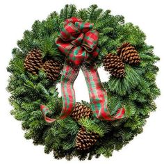 a christmas wreath with pine cones and plaid ribbon on it, isolated against a white background